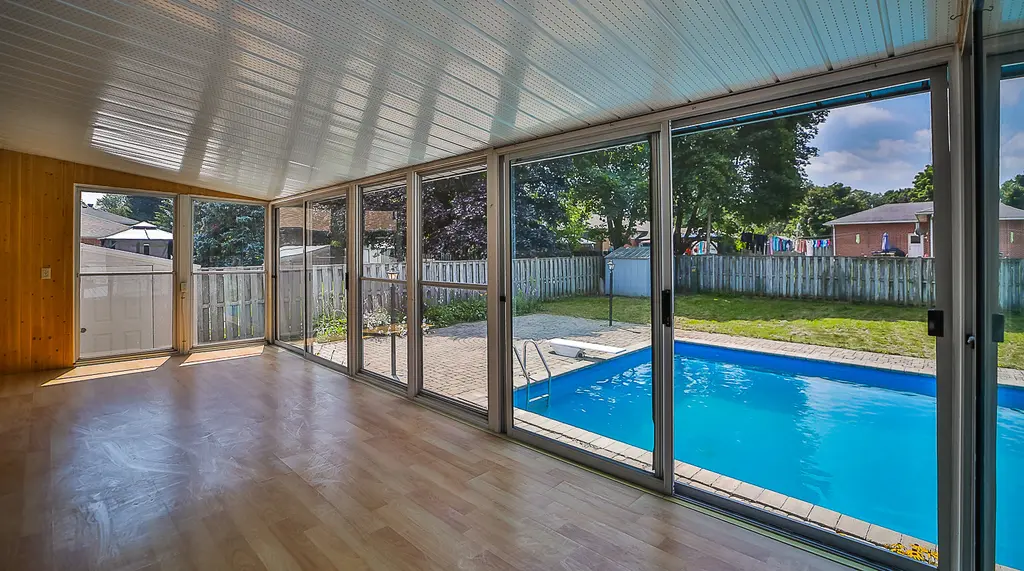 41 Spring Home — backyard pool seen from the sunroom